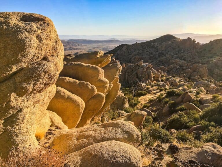 Scenic view of Pioneertown Mountains Preserve with large rocks and rugged terrain.